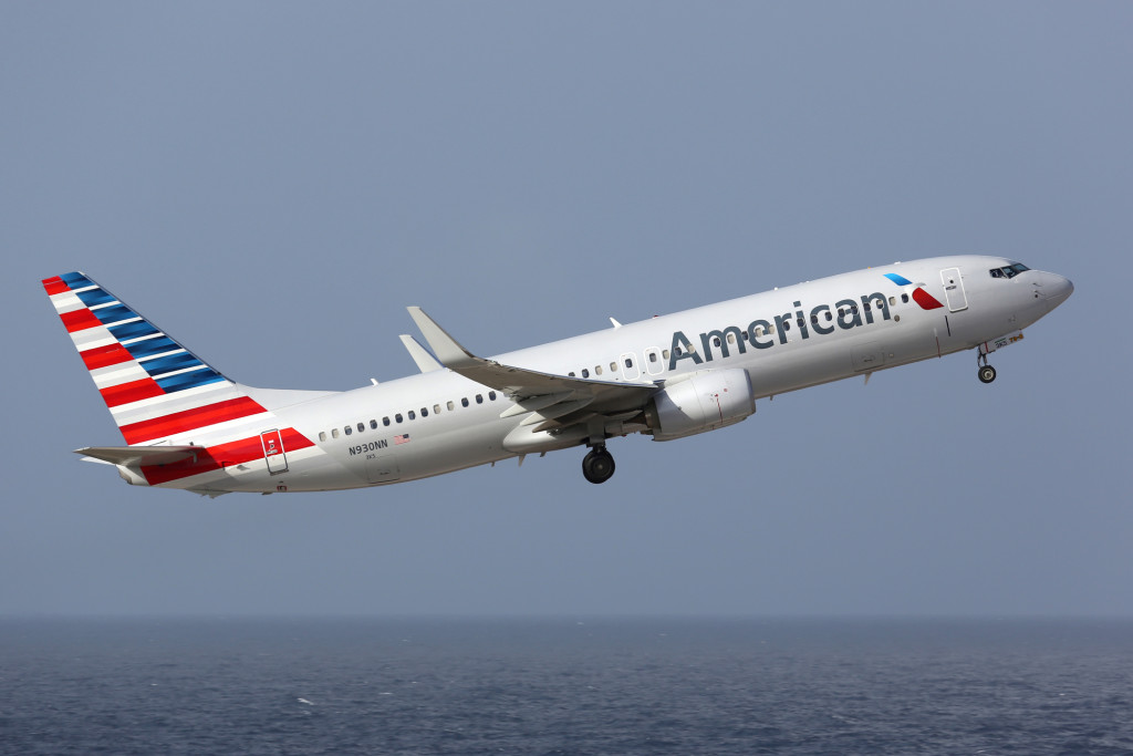Curacao - February 16, 2014: An American Airlines Boeing 737-800 with the registration N930NN taking off from Curacao Airport. American Airlines is the world's largest airline with 619 aircraft and 108 million passengers. It is headquartered in Fort Worth, Texas.