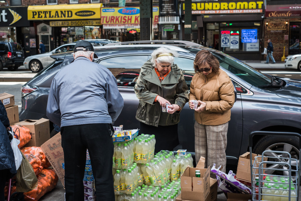Brighton Beach residents are picking free food that is about to expire. Photo by Pavel Terekhov