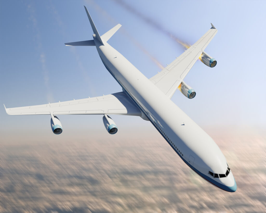 A commercial jet airplane with an engine on fire