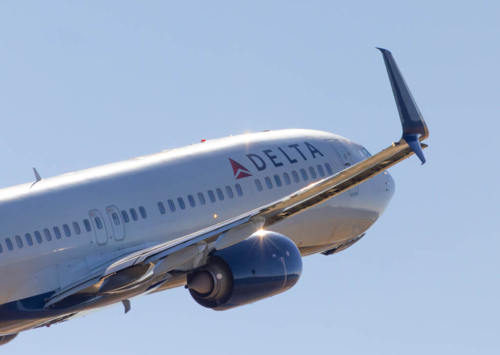 Delta Airlines Boeing 737 climbs out of International Airport Portland on sunny afternoon