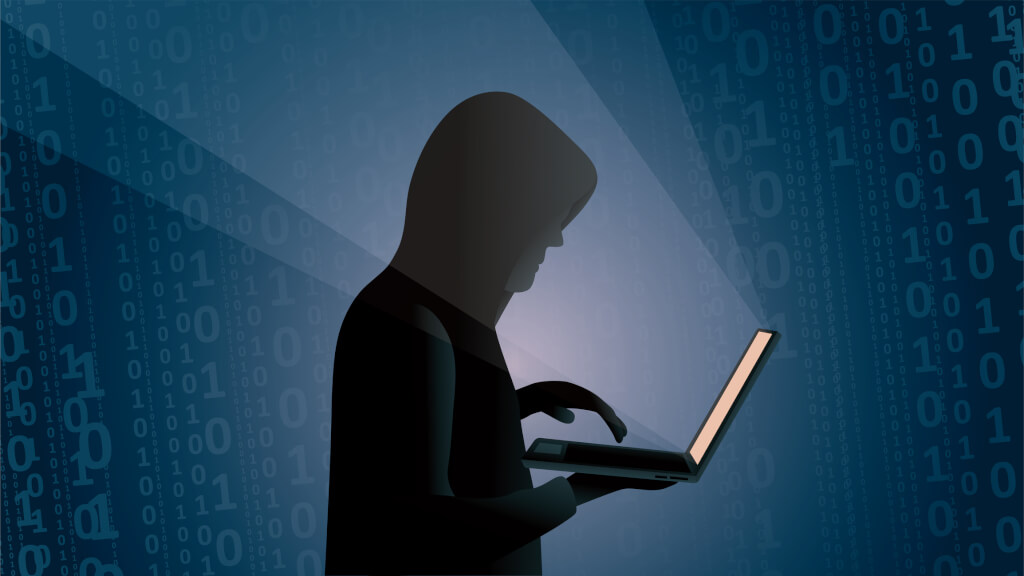 Side view of a young hacker writing binary codes in the dark on a blue background