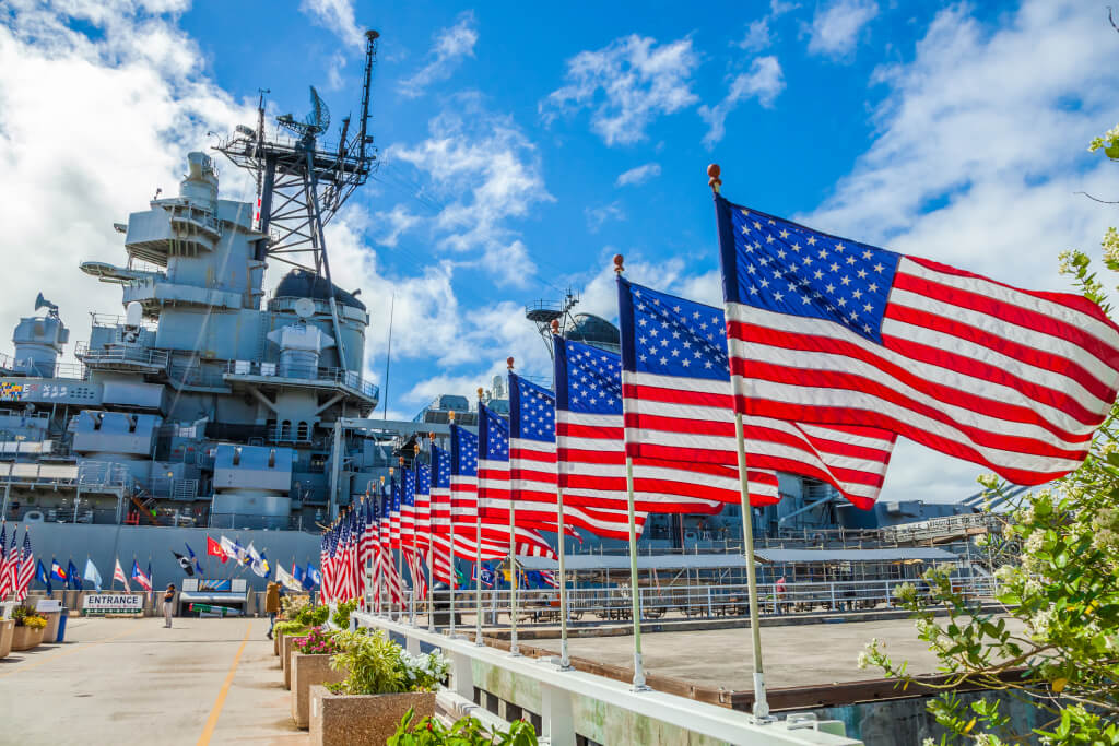 American flags in line at Missouri Warship Memorial in Pearl Harbor Honolulu Hawaii