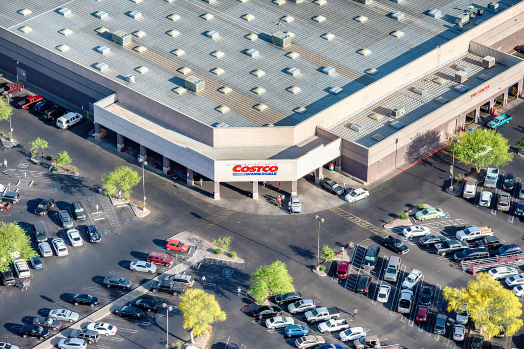 The exterior and store sign of a Costco warehouse wholesale outlet