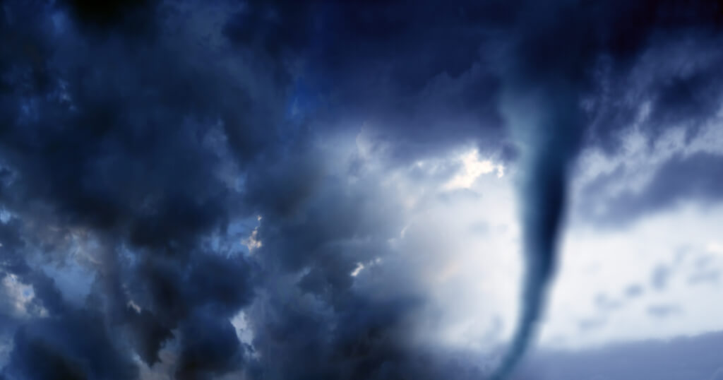 Conceptual image of cloudscape image of storm with dark clouds and approaching tornado